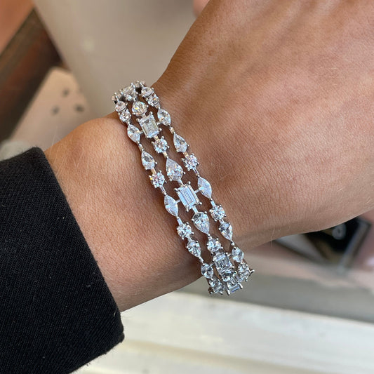 Silver CZ statement bangle by Insignia featuring a sleek design with sparkling cubic zirconia accents.