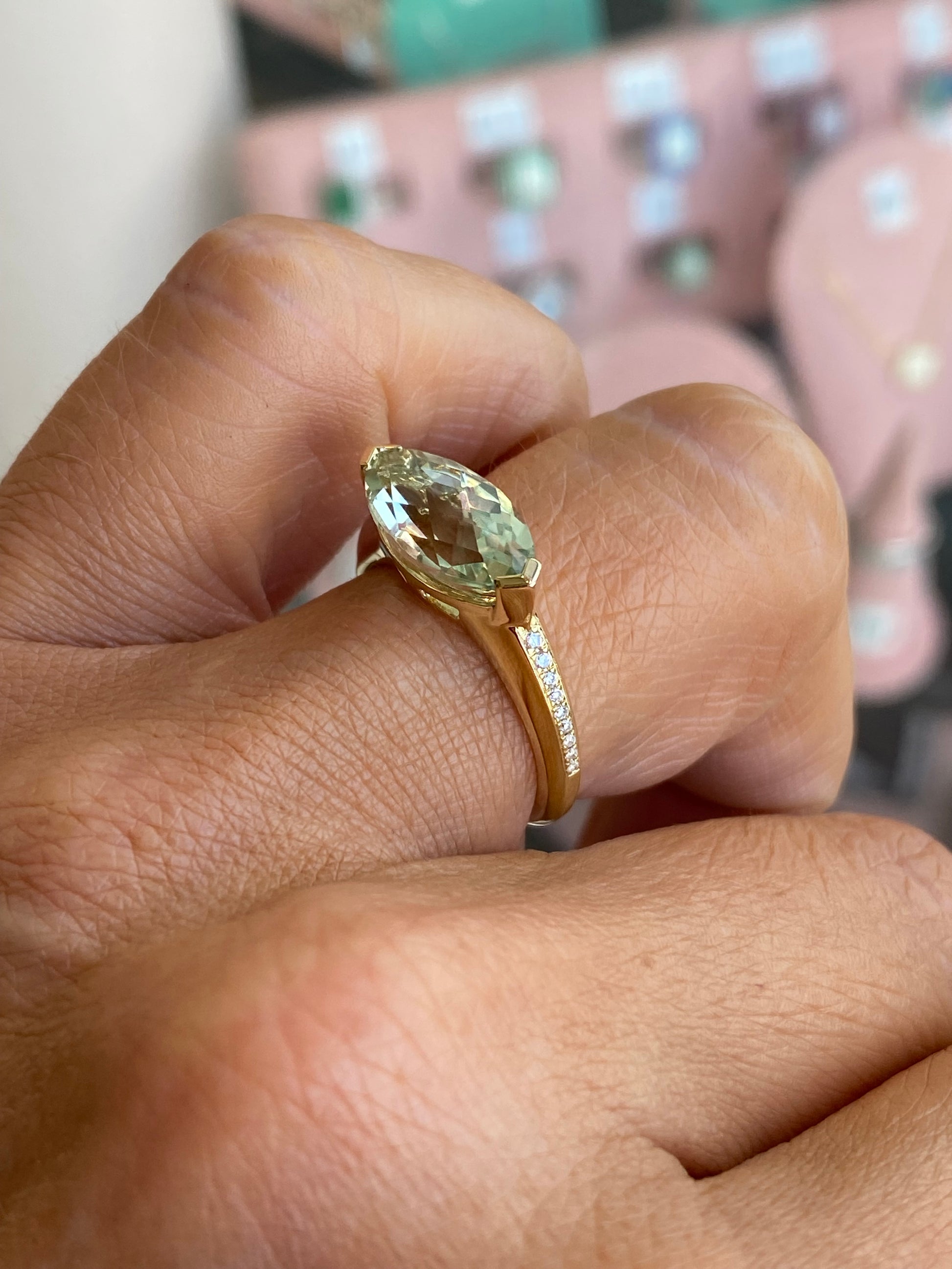 9ct gold green amethyst and diamond ring with intricate design, showcasing a vibrant green gemstone and sparkling diamonds.