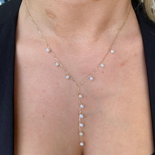 9ct gold freshwater pearl drop necklace featuring a delicate pearl pendant on a fine gold chain.