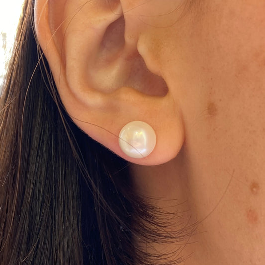 Silver freshwater pearl stud earrings from Insignia, featuring 10mm round pearls on classic earring posts.