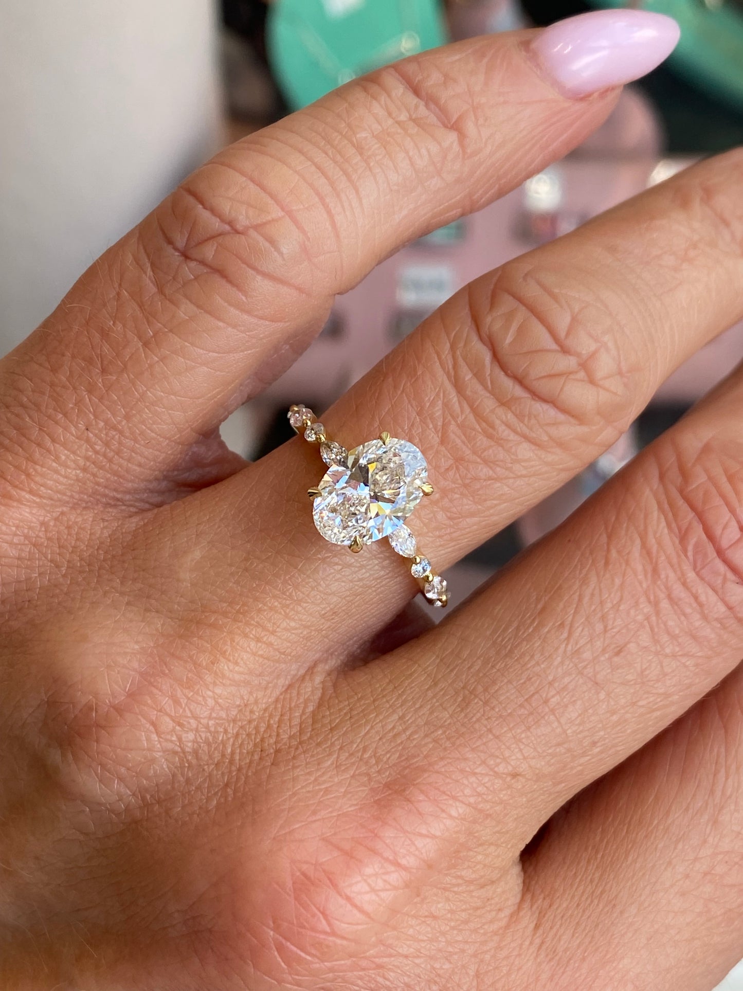 18ct gold oval solitaire engagement ring with a 2.01ct certificated lab diamond, featuring a sleek, elegant design by LMJ.