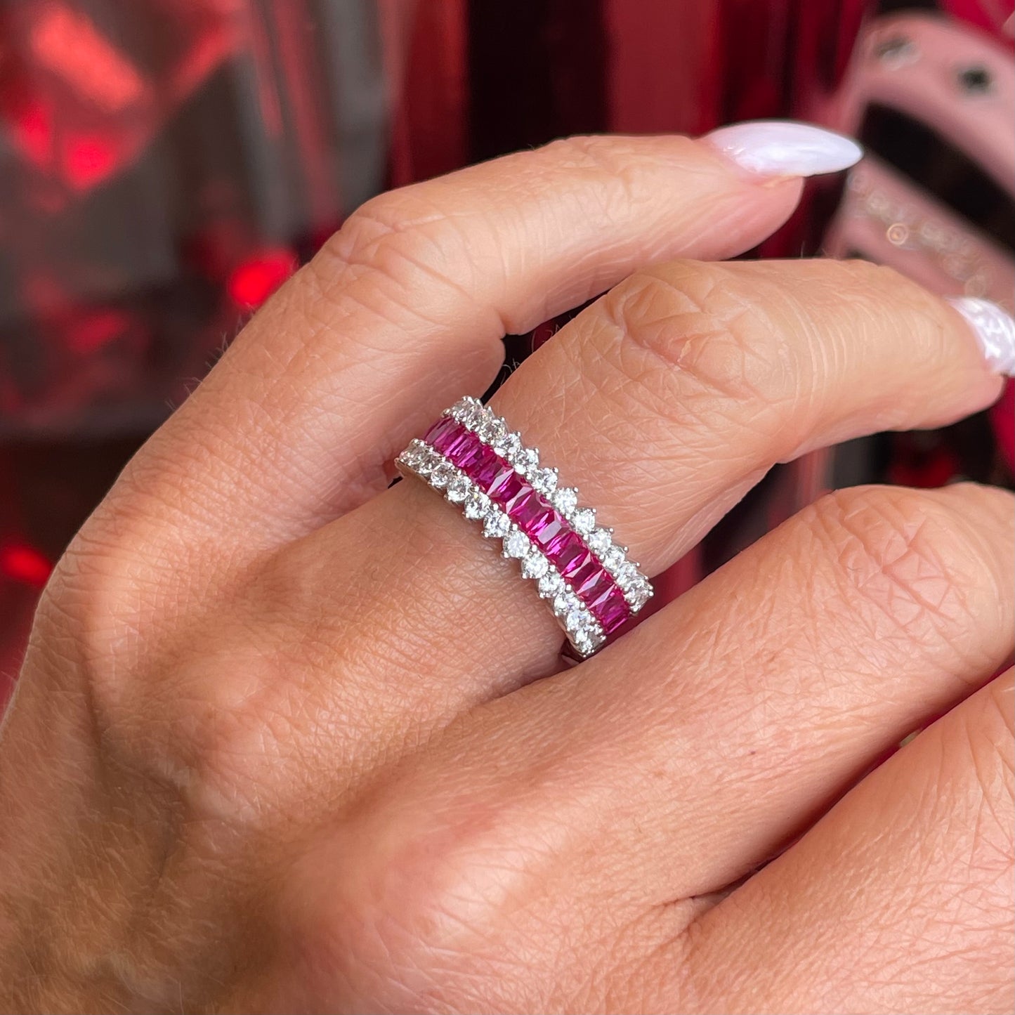 Silver spiky band ring by Comero with ruby red accents, featuring a bold, edgy design on a sleek silver band.