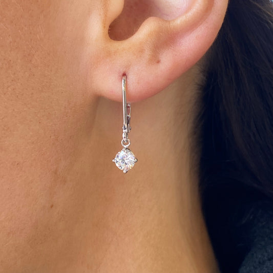 Silver 5mm CZ claw set drop earrings by Insignia featuring sparkling cubic zirconia stones and elegant drop design