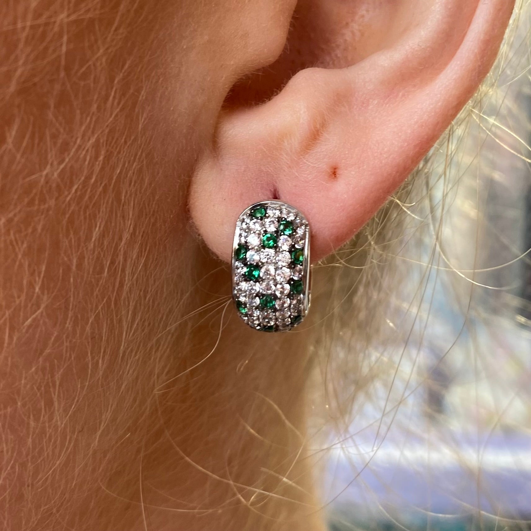Silver green ombre huggie hoop earrings by Comero, featuring a sleek silver design with green gradient accents.