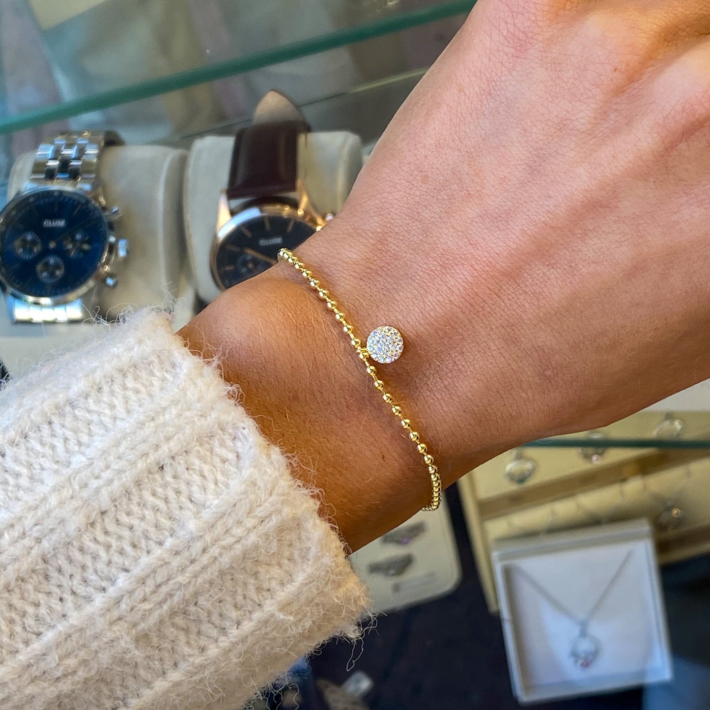 Sunshine CZ set disc bracelet by Comero featuring sparkling cubic zirconia accents on a sleek silver-tone band.