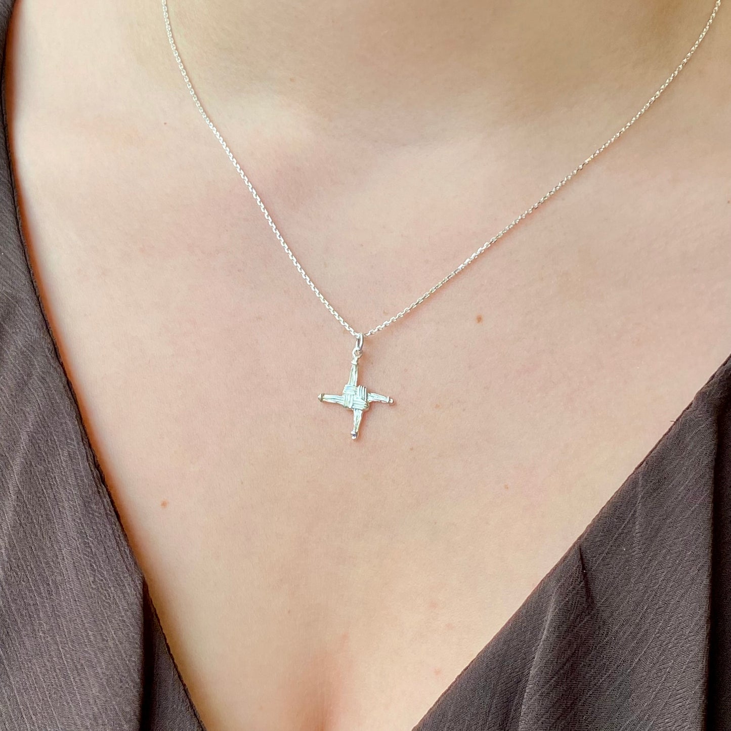 Silver St Bridget Cross Necklace by Clandela, featuring a detailed cross pendant on a delicate chain.
