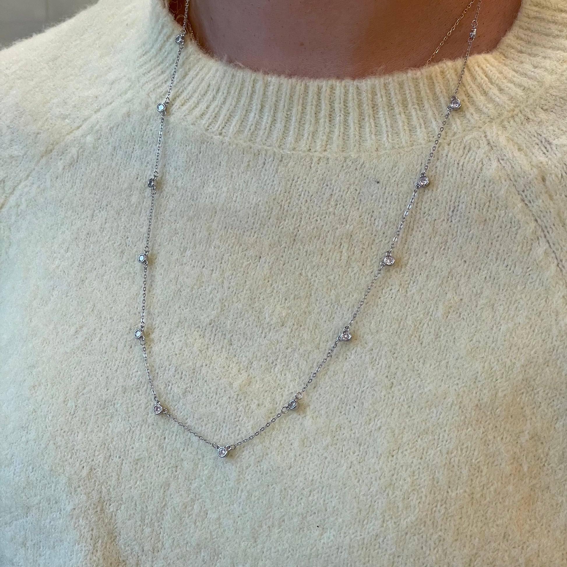 Silver CZ station necklace by Comero featuring sparkling cubic zirconia stones on a 60+5cm chain.