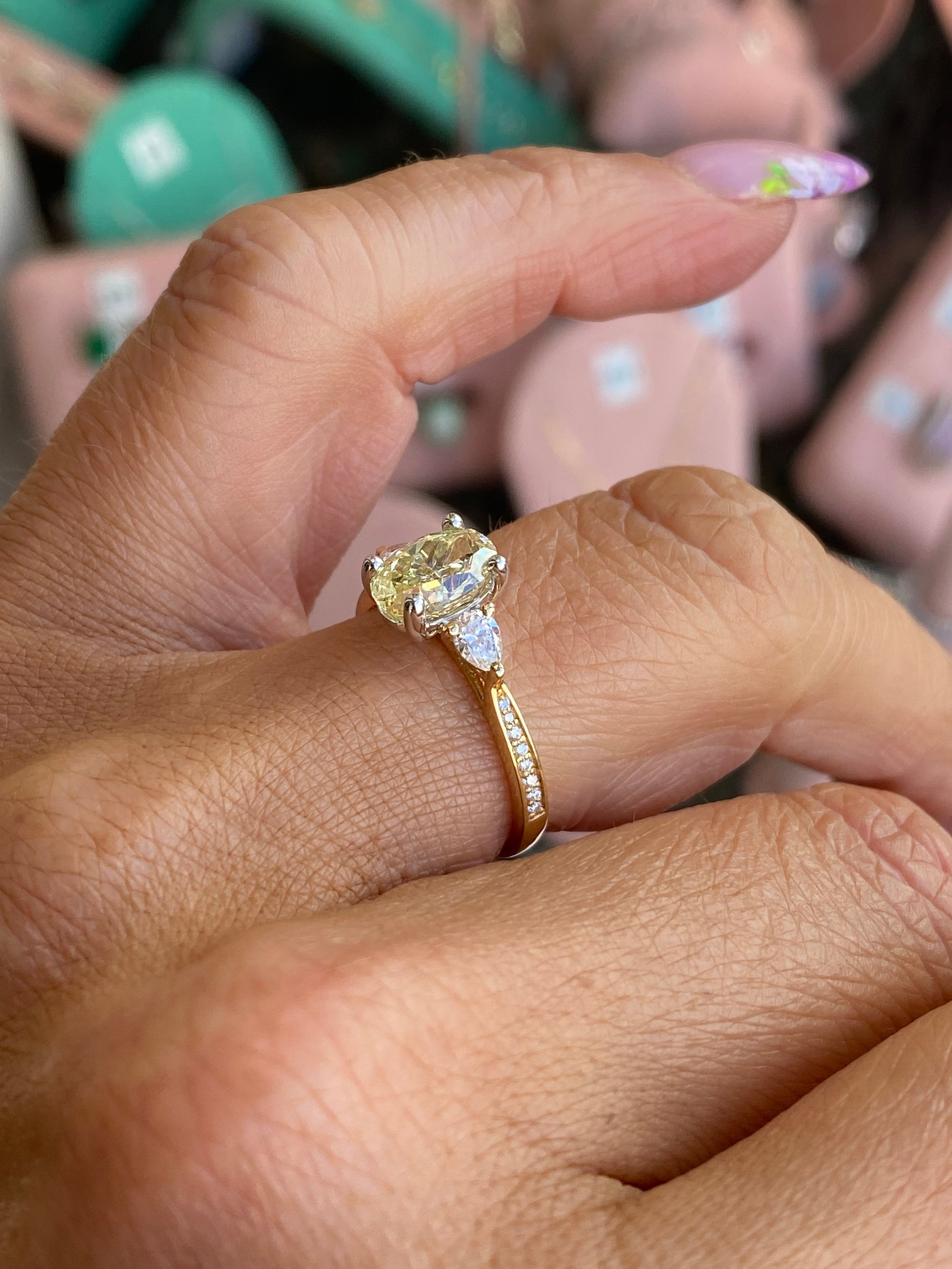 18ct gold fancy yellow oval solitaire engagement ring with a 1.50ct certificated lab diamond and elegant band design.
