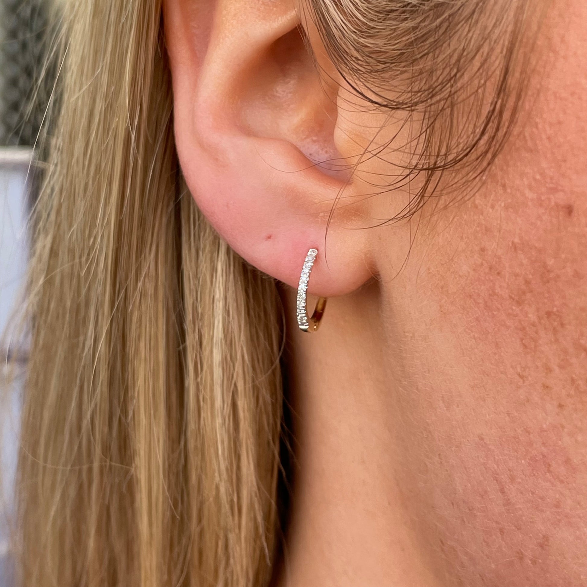 9ct gold diamond huggie hoop earrings with 0.08ct diamonds from Mark Milton, close-up of the elegant gold hoops with sparkling diamonds.