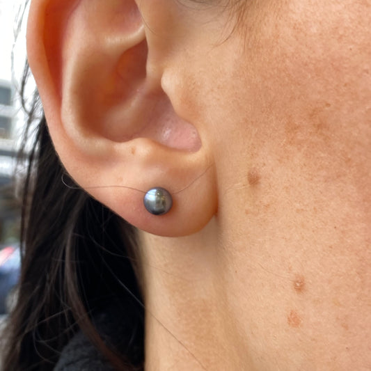 Silver 5mm freshwater pearl stud earrings in green by Insignia, featuring elegant pearl jewelry with a polished silver setting.