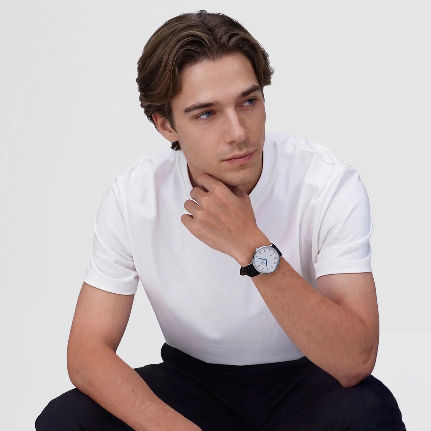 Daniel Wellington Classic silver watch with black croc strap, Roman numerals, and date display, 40mm size.