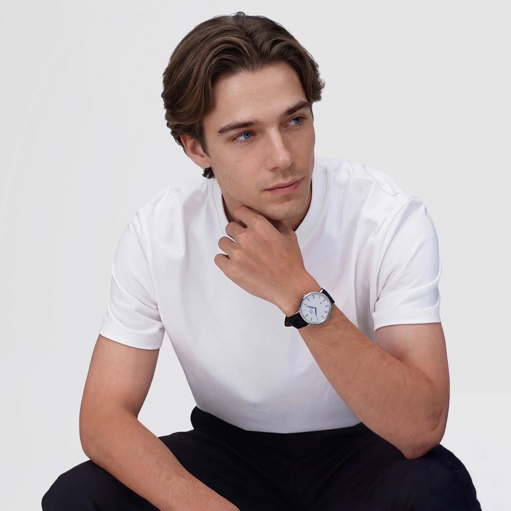 Daniel Wellington Classic silver watch with black croc strap, Roman numerals, and date display, 40mm size.