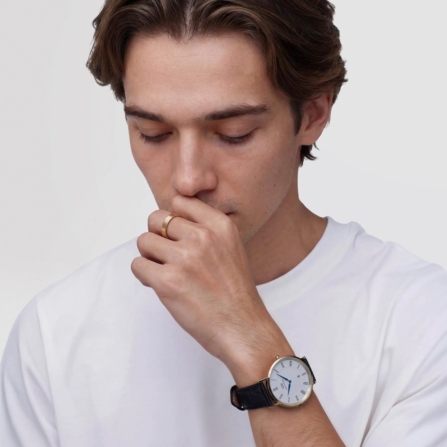 Daniel Wellington Classic Roman Numerals Date black leather strap 40mm watch, showing a sleek black dial with Roman numeral markers.