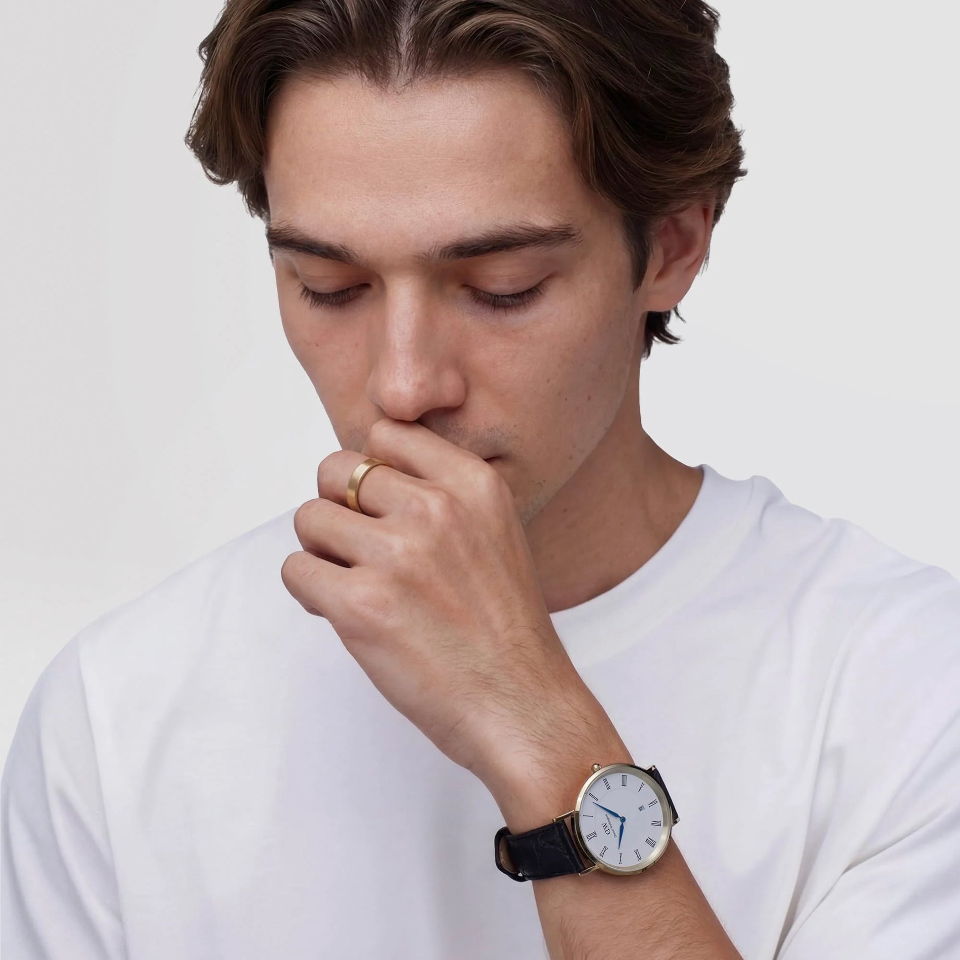 Daniel Wellington Classic Roman Numerals Date black leather strap 40mm watch, showing a sleek black dial with Roman numeral markers.