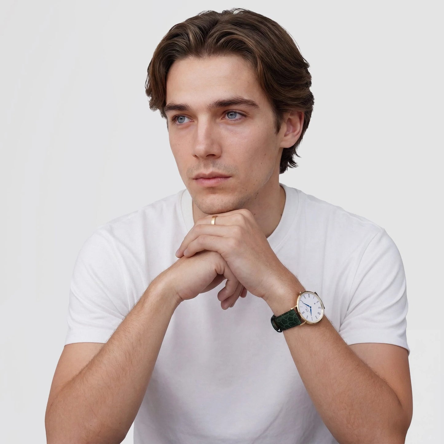 Daniel Wellington Classic Roman Numerals Date Green Croc 40mm watch with green leather strap and silver case, showing time and date.