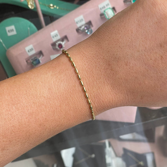 Sunshine Seed Bracelet by CME featuring yellow seed beads and adjustable cord for a stylish, natural jewelry accessory.