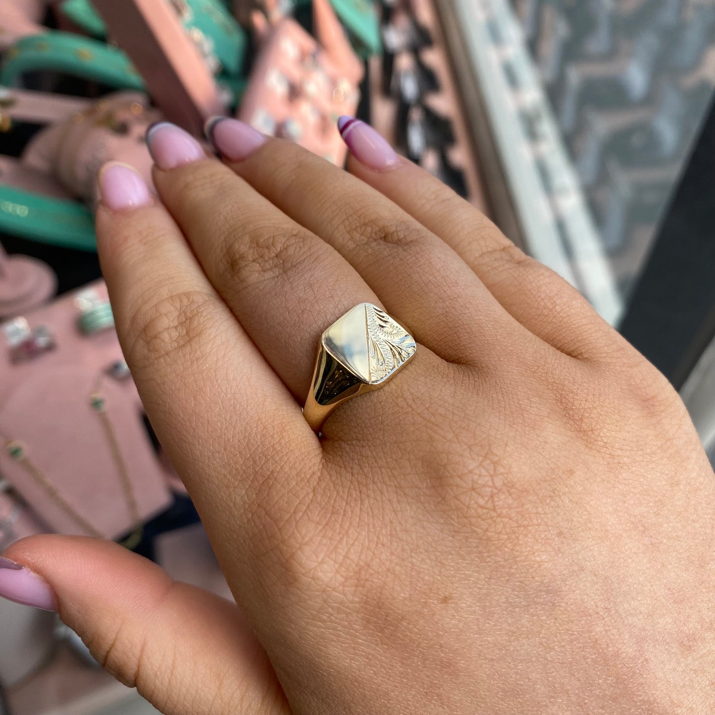 9ct gold gents square signet ring with engraved design, featuring a polished gold band and a prominent square face.