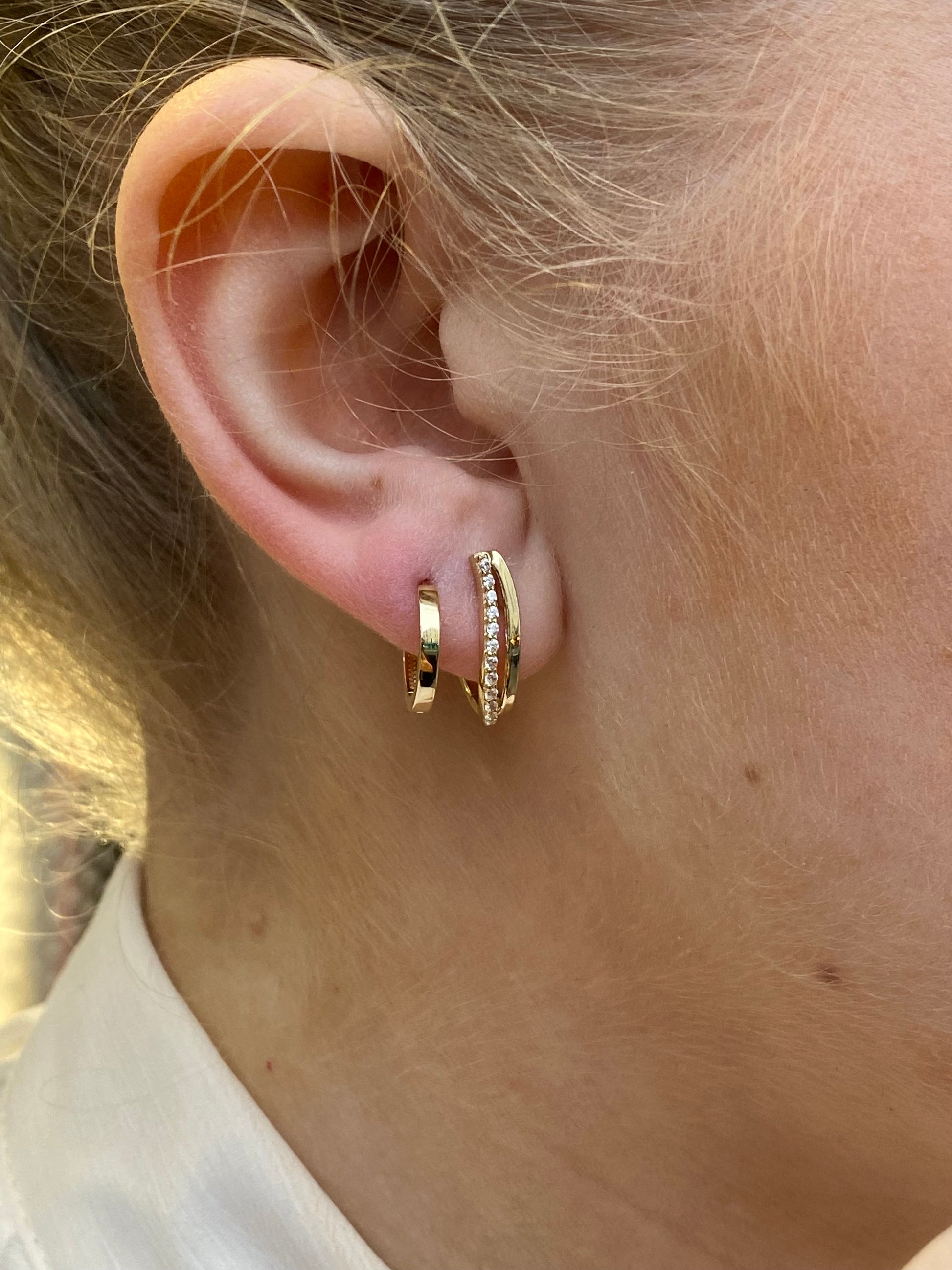 9ct gold CZ hoop earrings by NJO featuring shiny, circular earrings with cubic zirconia stones for an elegant look.