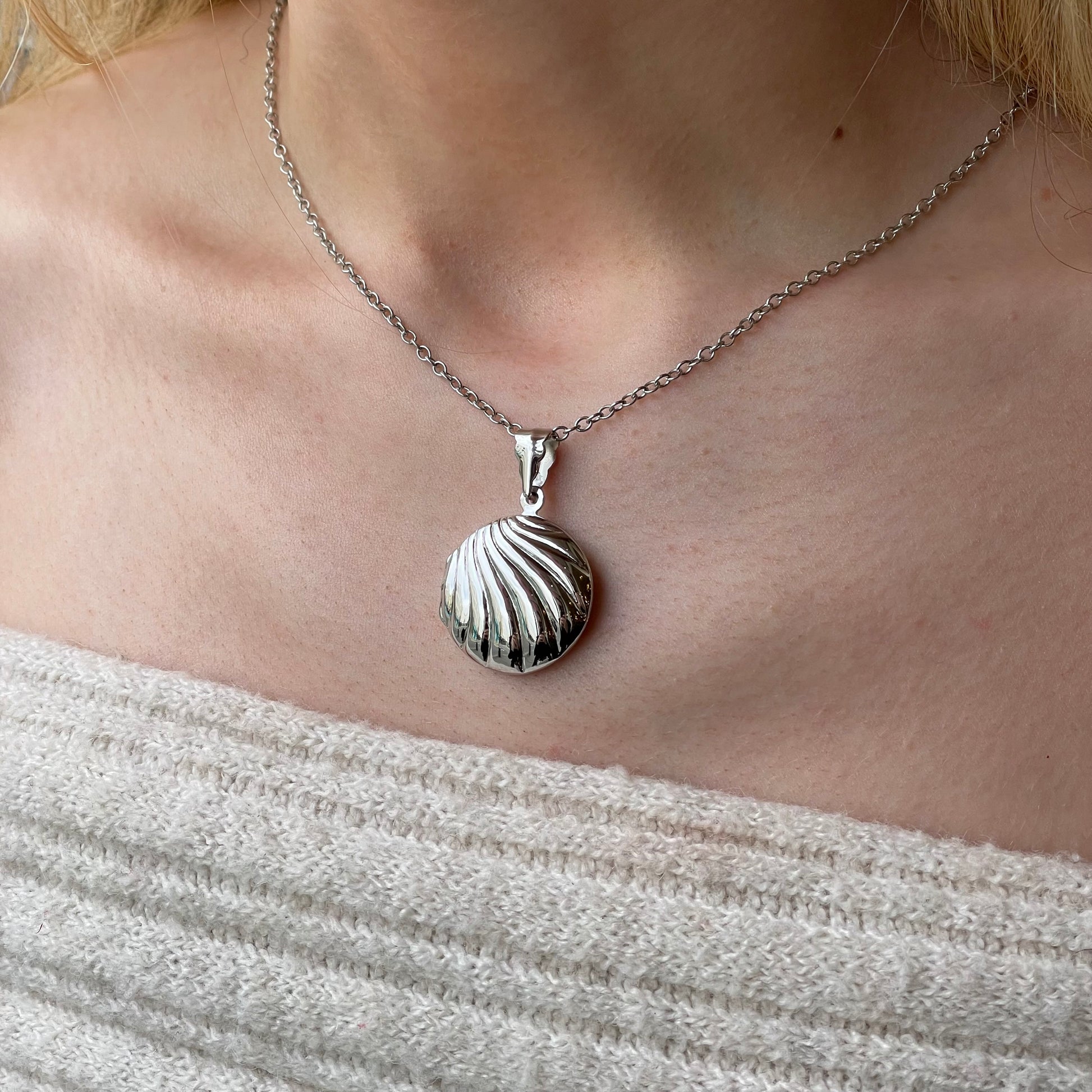 Silver round fluted locket necklace with chain, stylish jewelry piece from Insignia featuring a detailed, polished design