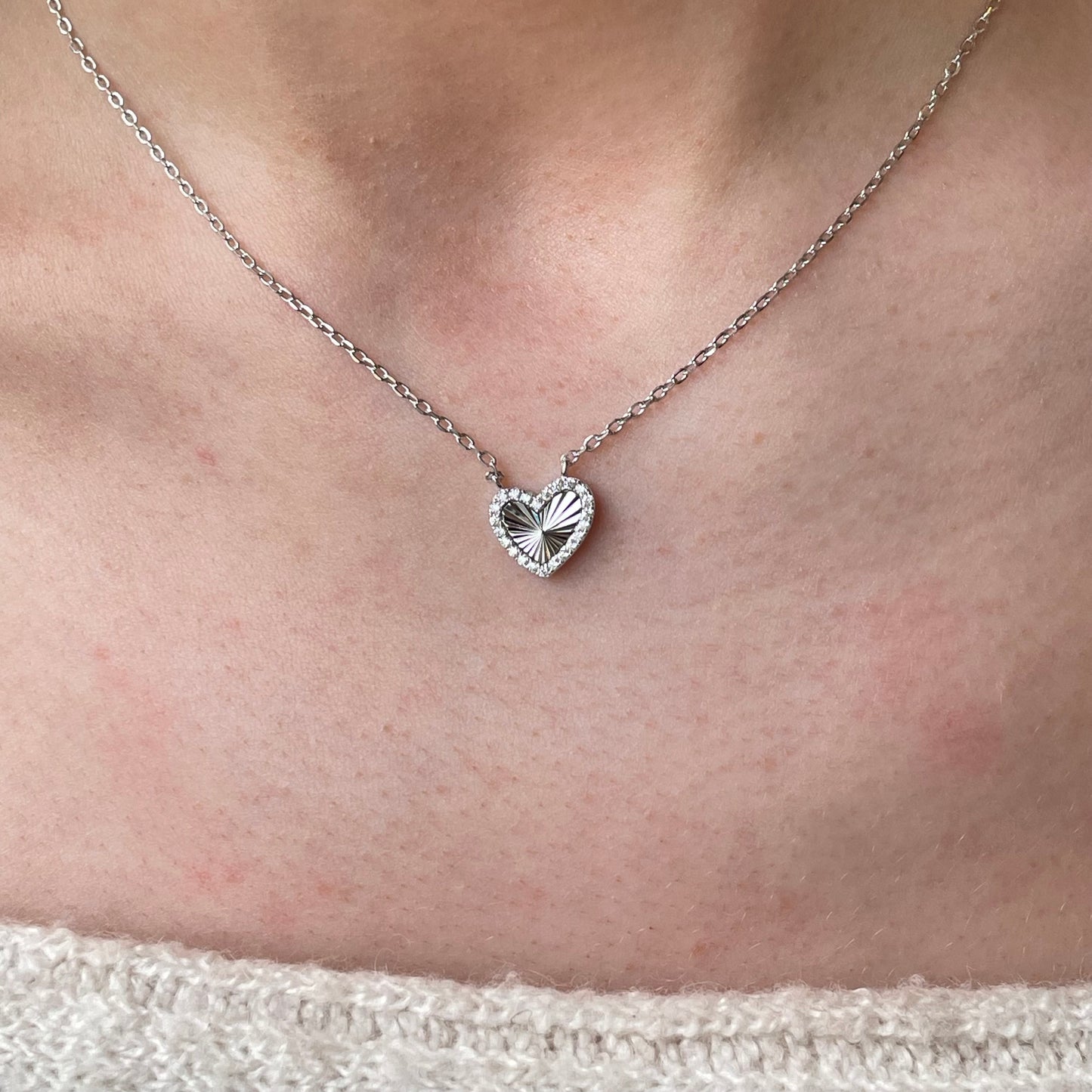 Silver CZ heart necklace with 40+5cm chain from Comero, featuring a sparkling heart pendant on a delicate silver chain.