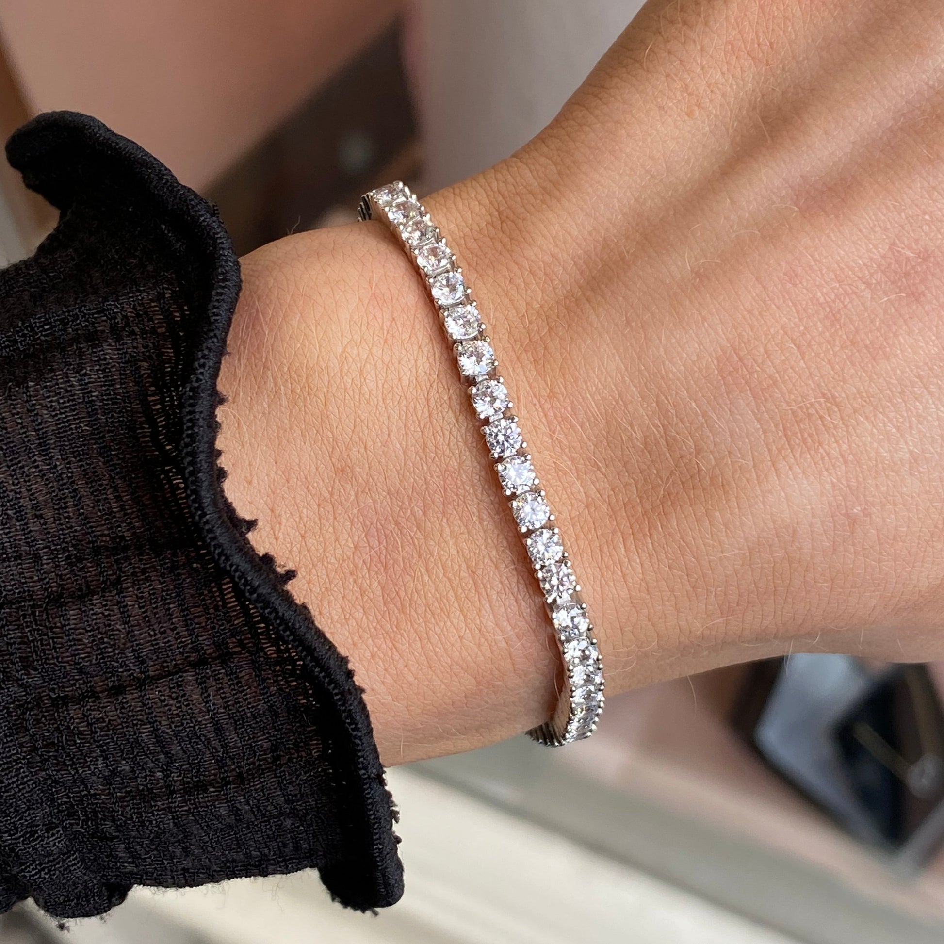 Silver Trisha bracelet by Comero featuring a sleek, polished design with delicate chain links and elegant clasp detail.