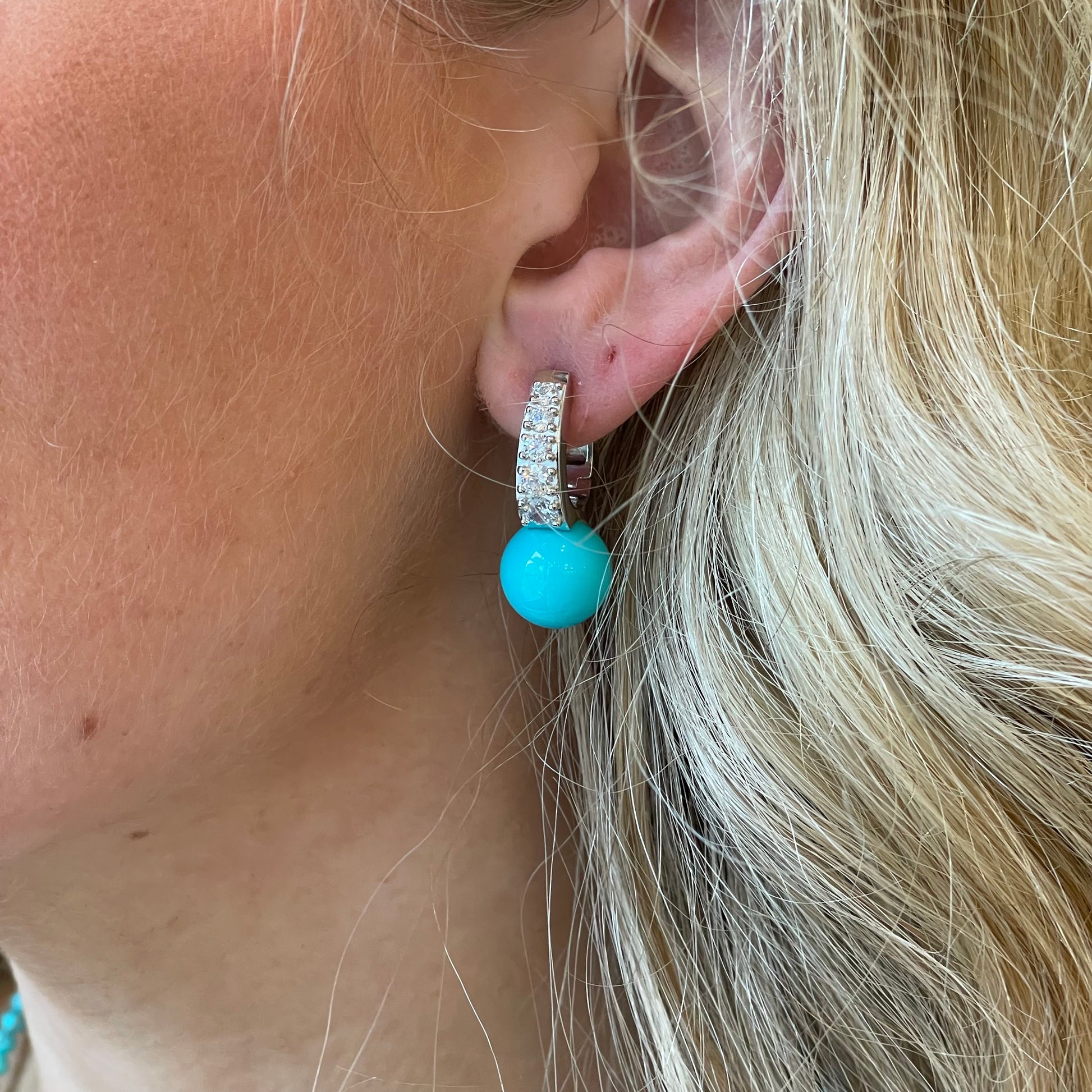 Silver CZ and 12mm faux turquoise hoop earrings by Comero featuring shiny silver hoops with sparkling CZ stones and faux turquoise accents