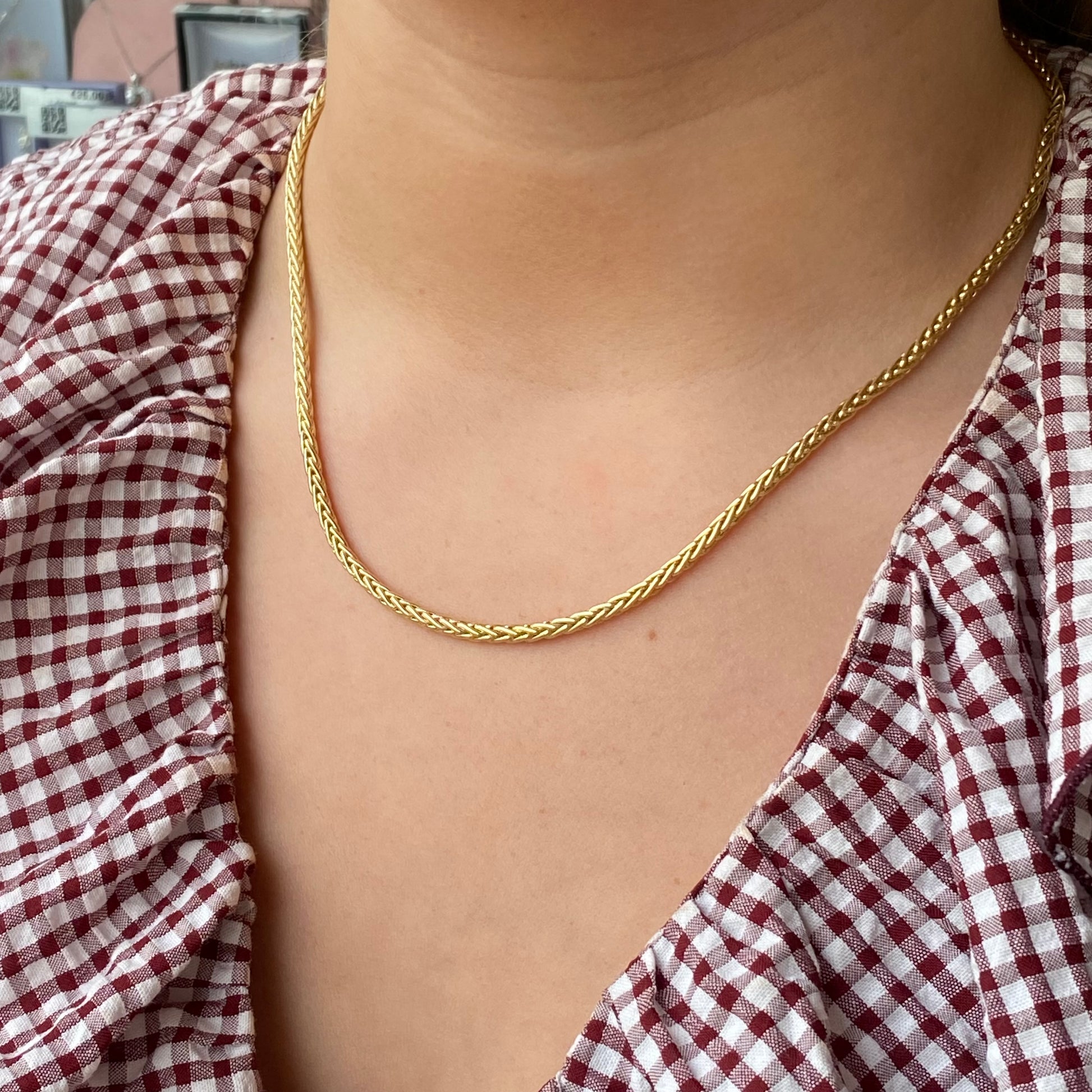 9ct gold Palmier necklace by Mark Milton featuring a detailed palm leaf pendant on a delicate chain.