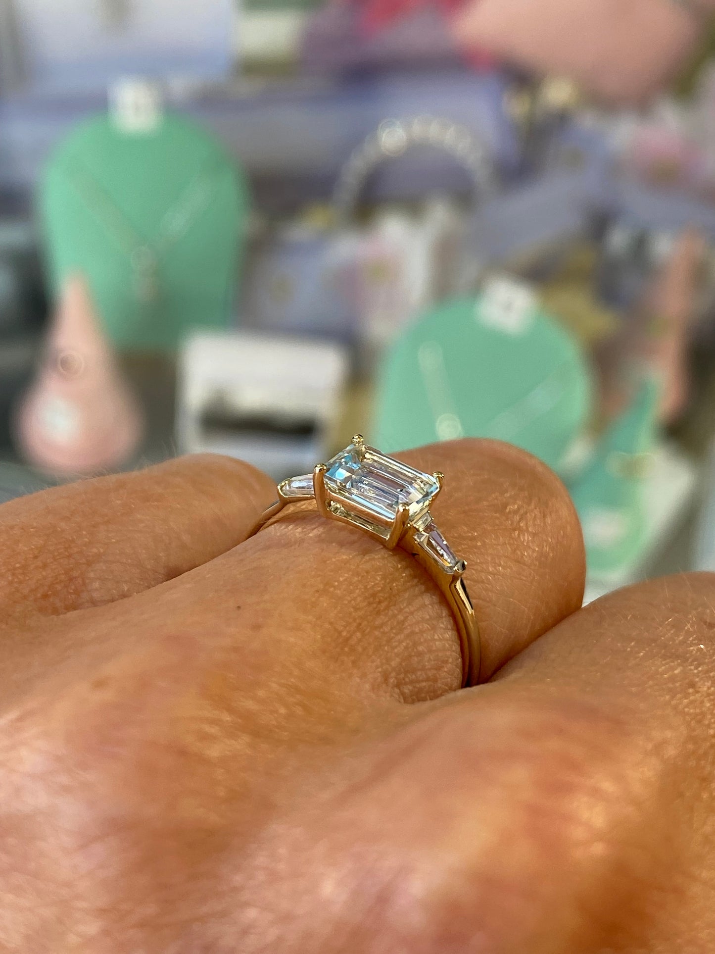 9ct gold east-west ring featuring sky blue topaz and cubic zirconia, with a sleek, elegant design by Insignia.