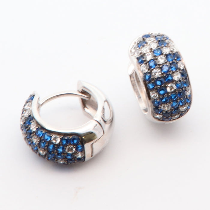 Silver blue ombre huggie hoop earrings by Comero, small round earrings with a gradient blue finish, stylish jewelry accessory.