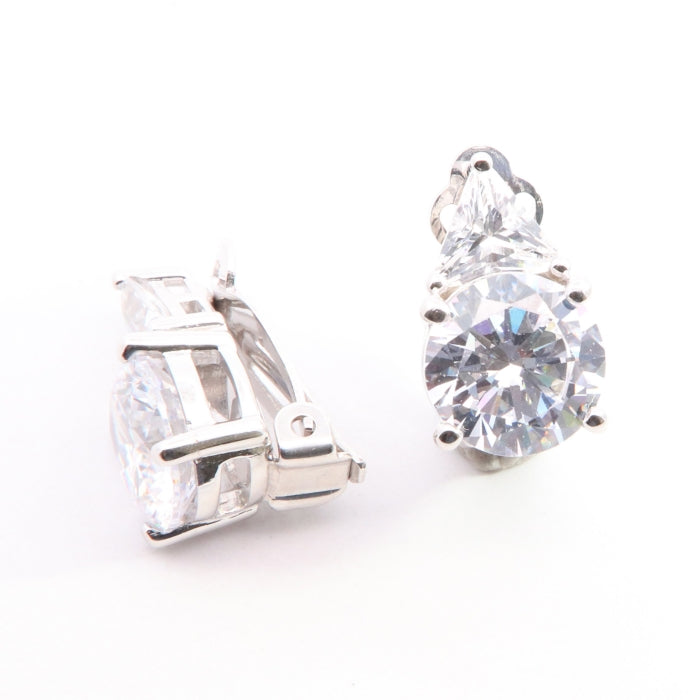 Silver CZ clip-on earrings by Comero with sparkling cubic zirconia stones and classic design, suitable for elegant occasions.
