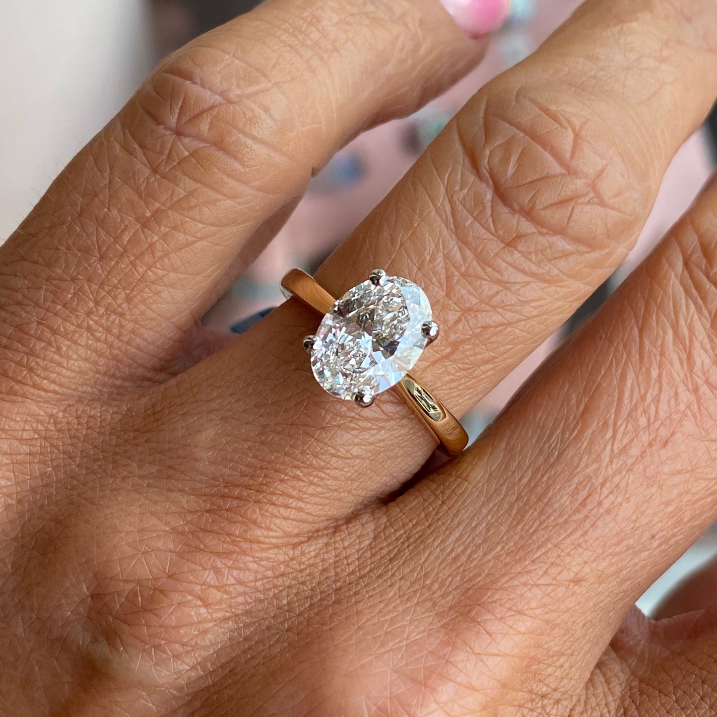 18ct gold oval solitaire engagement ring with a 2.30ct certified diamond, featuring a classic design by Prima.