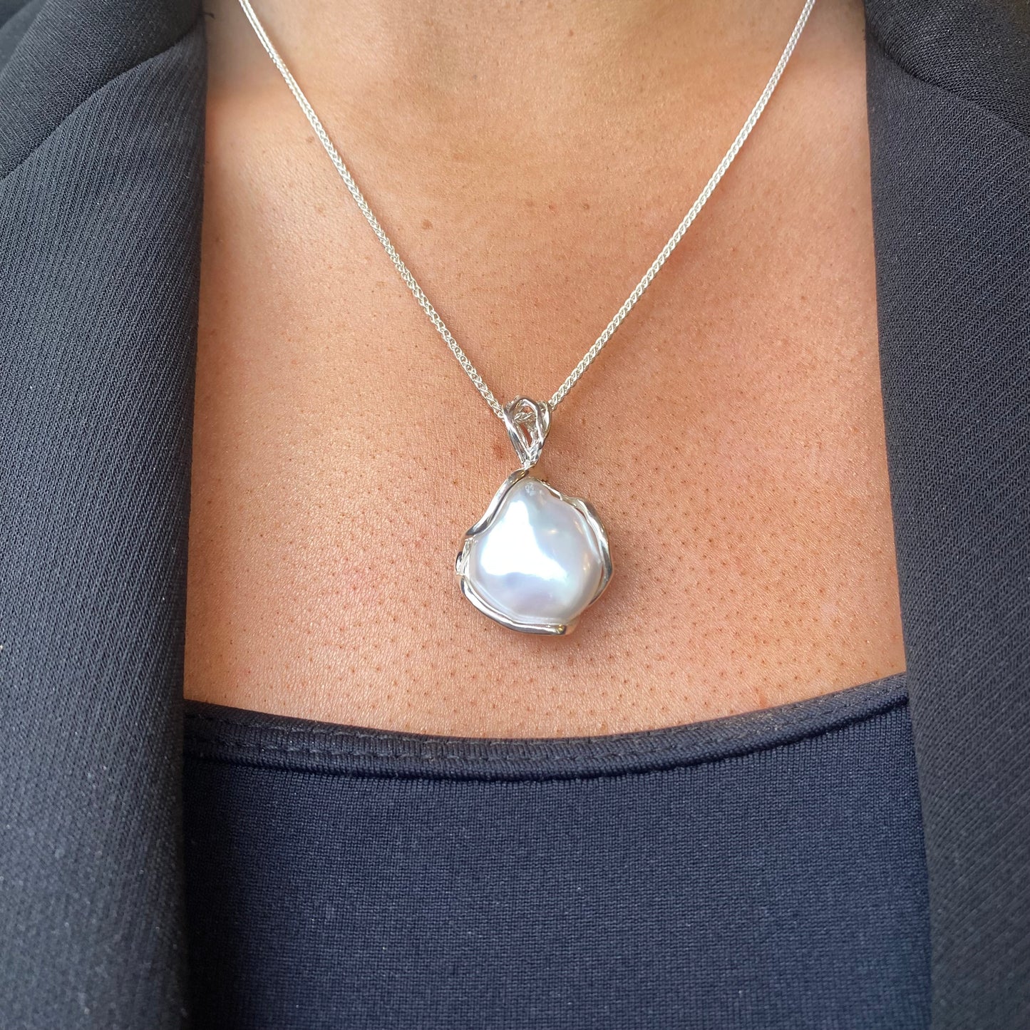 Bruno silver Baroque pearl pendant necklace featuring a large irregular pearl on a delicate chain.