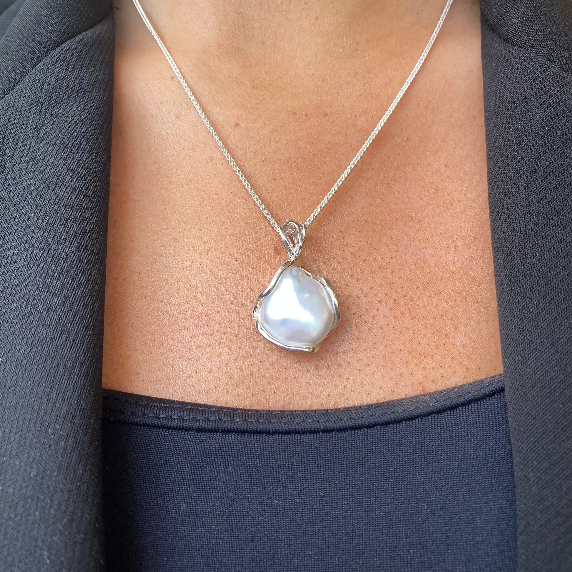 Bruno silver Baroque pearl pendant necklace featuring a large irregular pearl on a delicate chain.