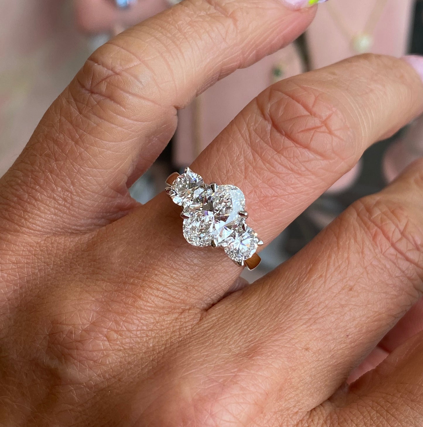 18ct gold oval trilogy engagement ring with three sparkling diamonds, lab certified, by TCA, featuring a classic and elegant design.