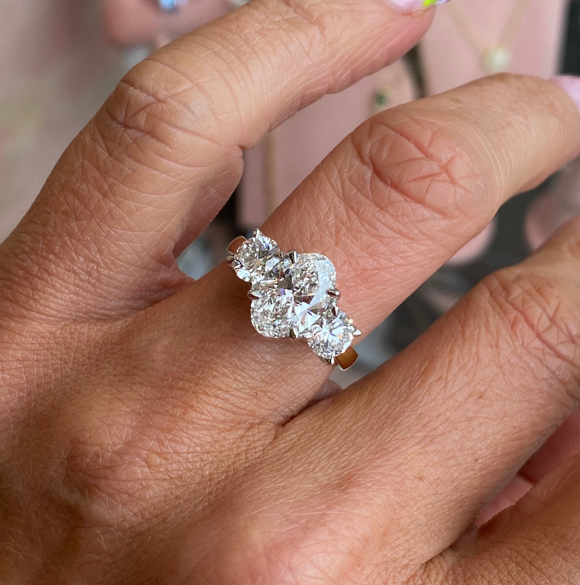 18ct gold oval trilogy engagement ring with three sparkling diamonds, lab certified, by TCA, featuring a classic and elegant design.