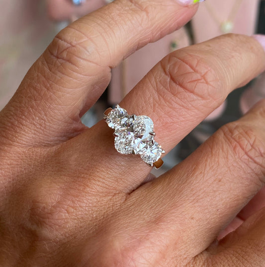 18ct gold oval trilogy engagement ring with three sparkling diamonds, lab certified, by TCA, featuring a classic and elegant design.