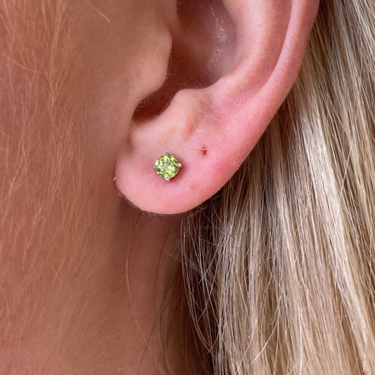 Silver Peridot solitaire earring and necklace set by Insignia featuring matching jewelry with green gemstones and elegant design.