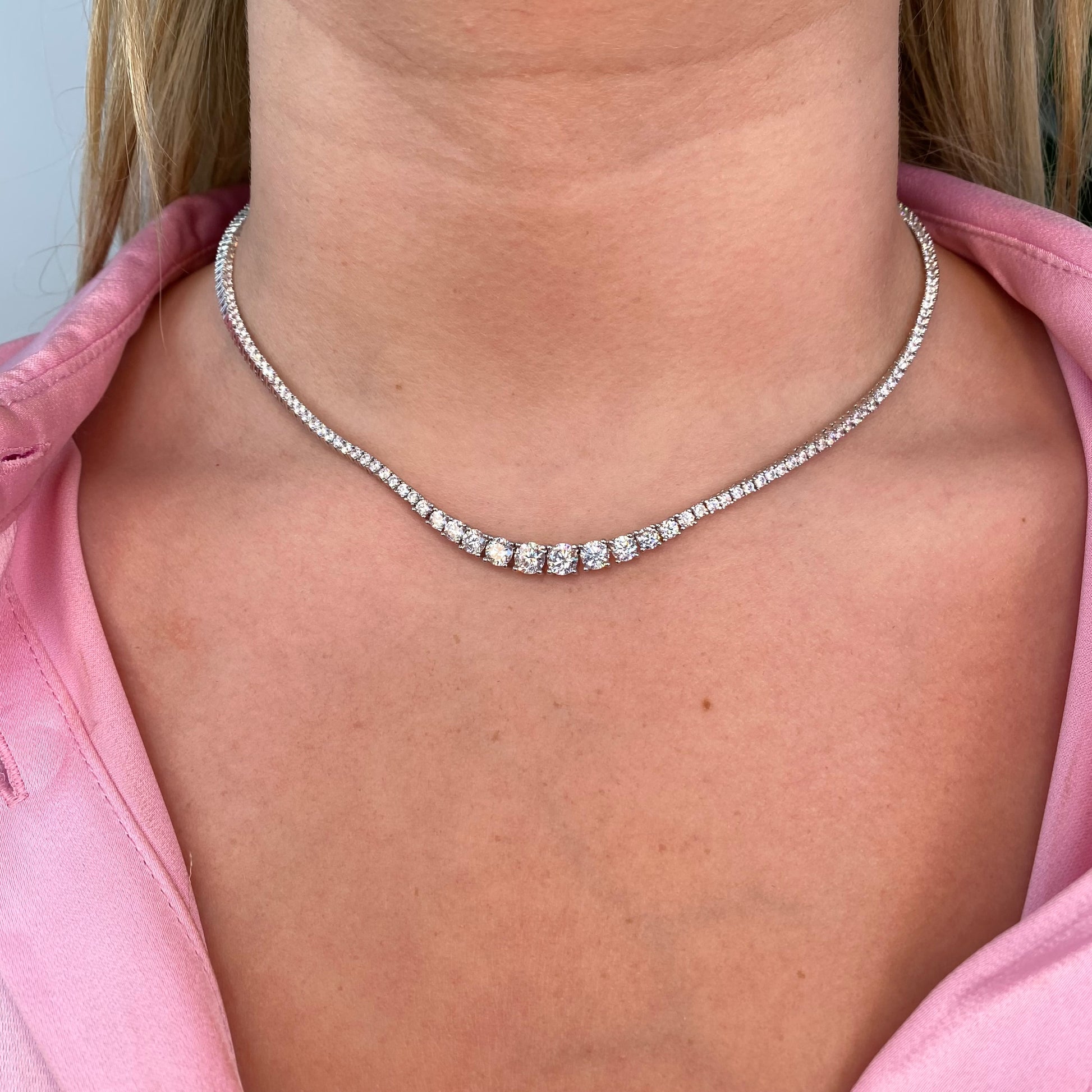 Silver Samantha Necklace by Comero featuring a delicate chain and elegant pendant on a white background.