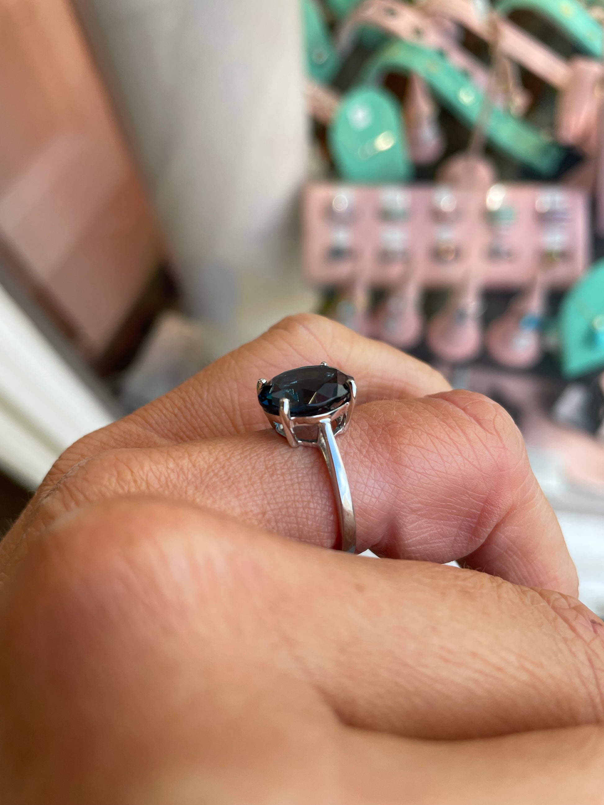 Herbert 9ct white gold oval cut London Blue Topaz ring with a central blue gemstone and smooth band.