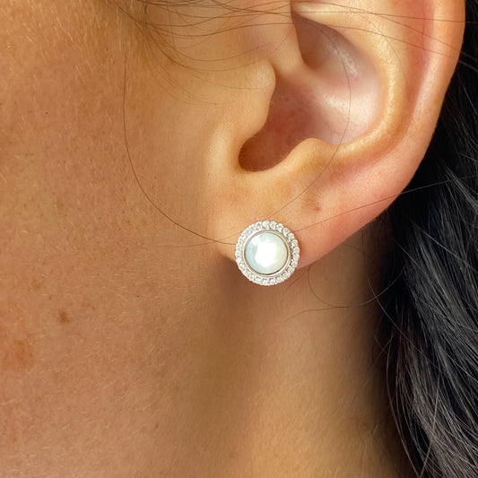 Silver Mother of Pearl and CZ stud earrings by Insignia, featuring elegant pearl and sparkling cubic zirconia details.