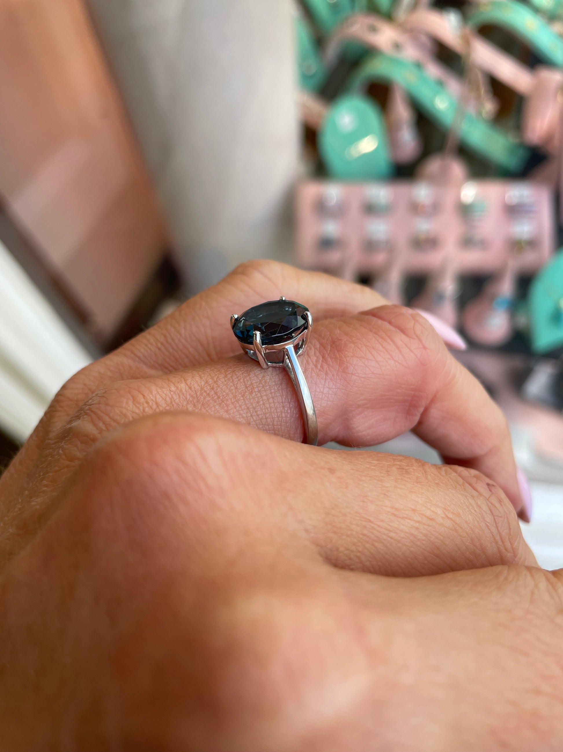 Herbert 9ct white gold oval cut London Blue Topaz ring with a detailed band, showcasing the vibrant gemstone.