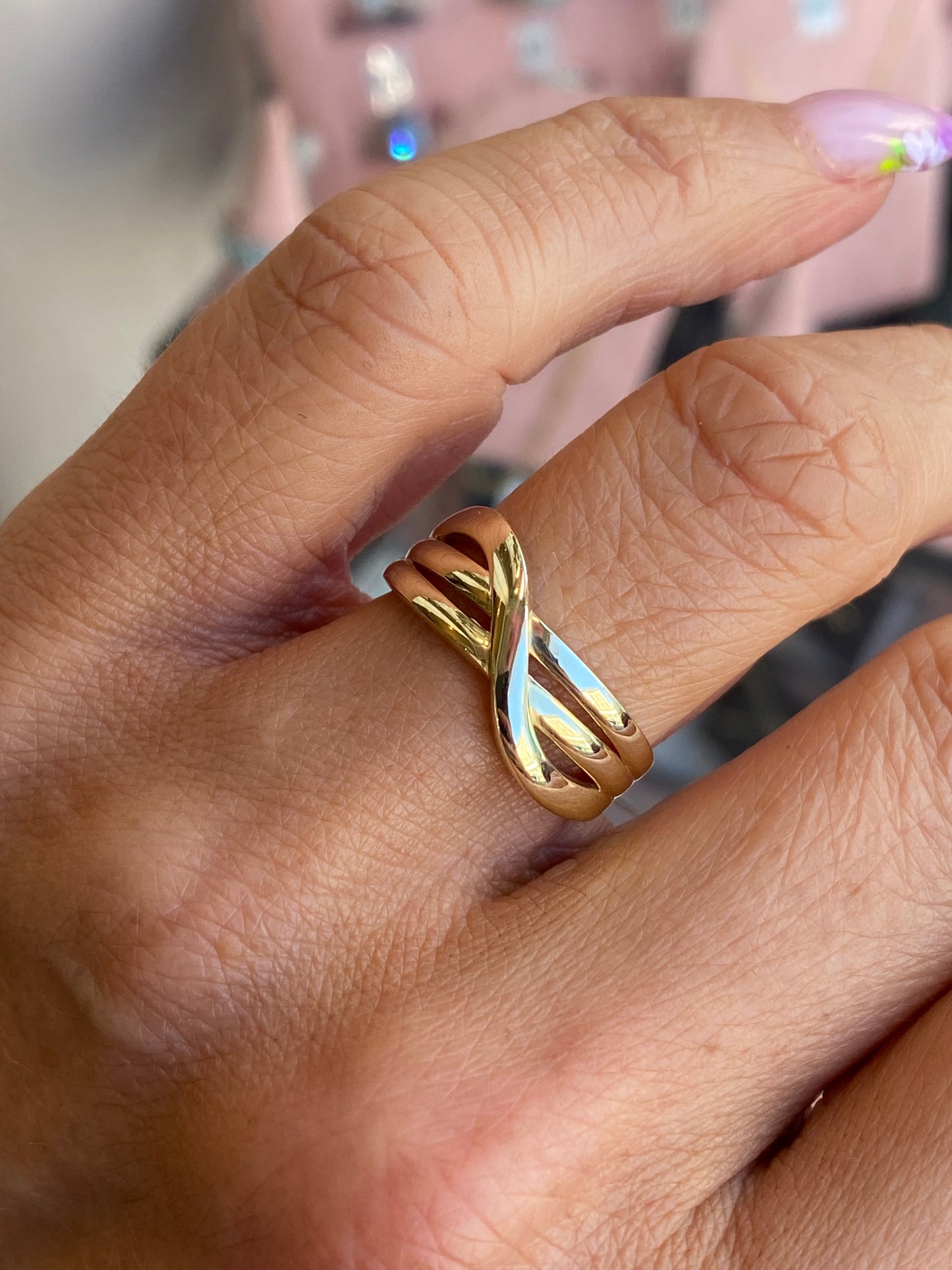 9ct gold crossover ring with sleek design, crafted by NJO, featuring smooth gold band with elegant overlapping style.