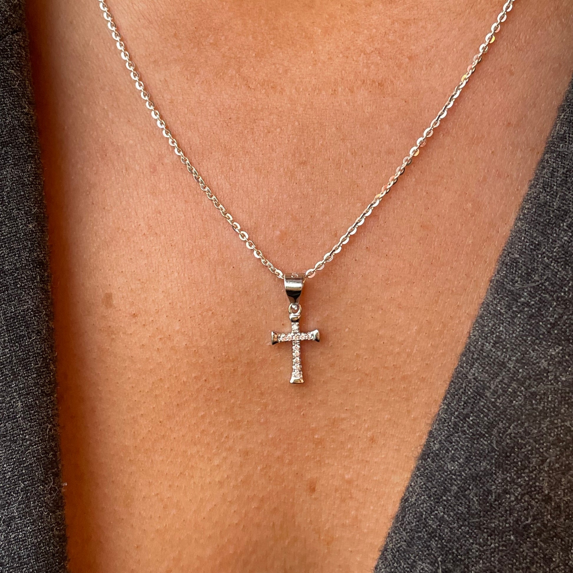 Silver CZ Cross Necklace from Comero, 18-inch chain with a sparkling cross pendant, stylish jewelry accessory.