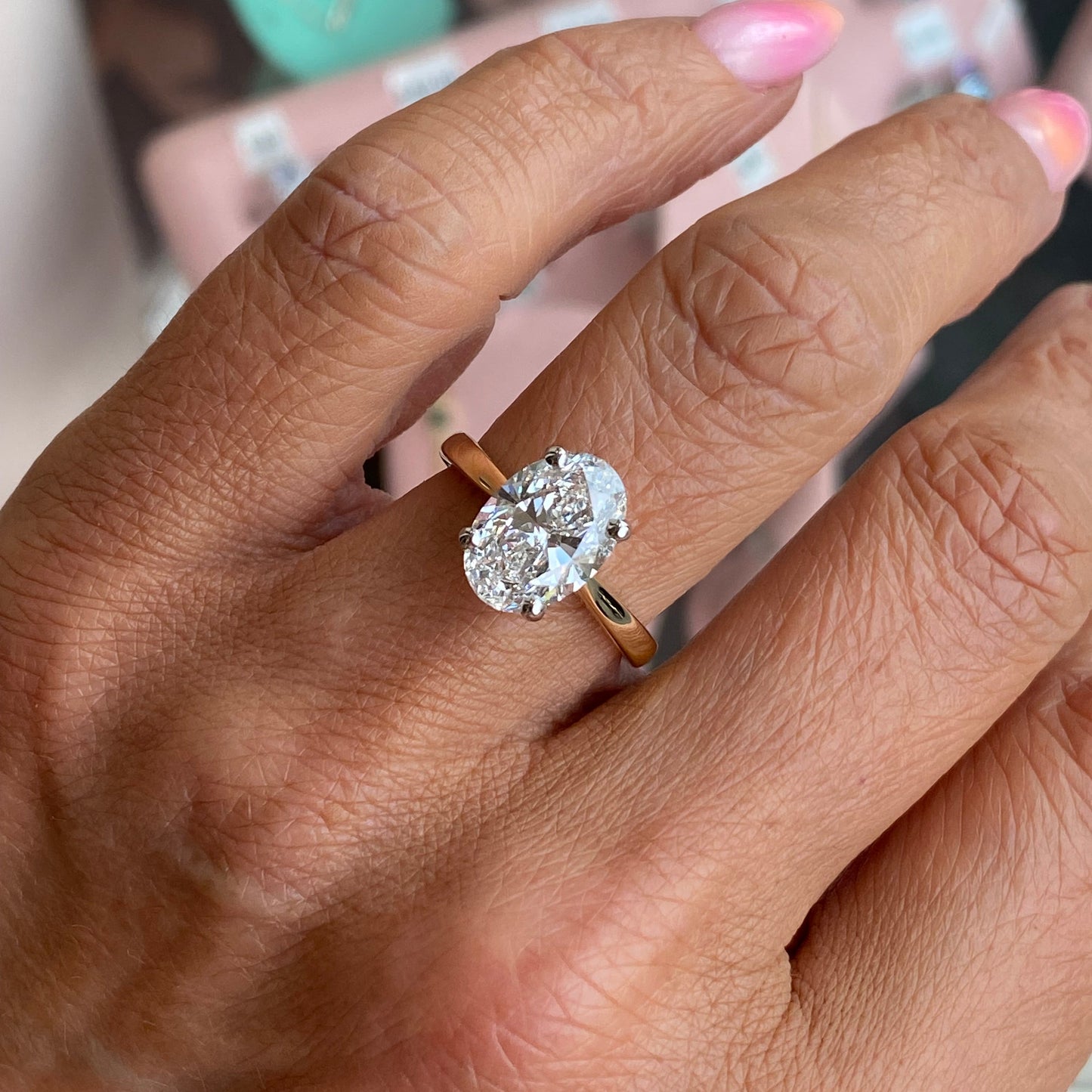 Prima 18ct gold oval solitaire engagement ring with a 3.02ct certified diamond, featuring a sleek and elegant design.