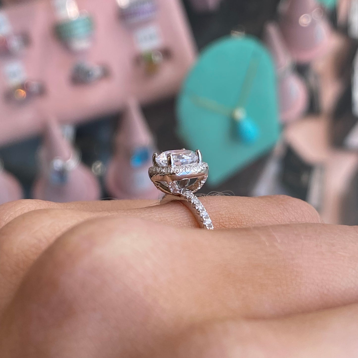 Silver cushion CZ ring by THC featuring a sparkling cubic zirconia stone set in a sleek band.