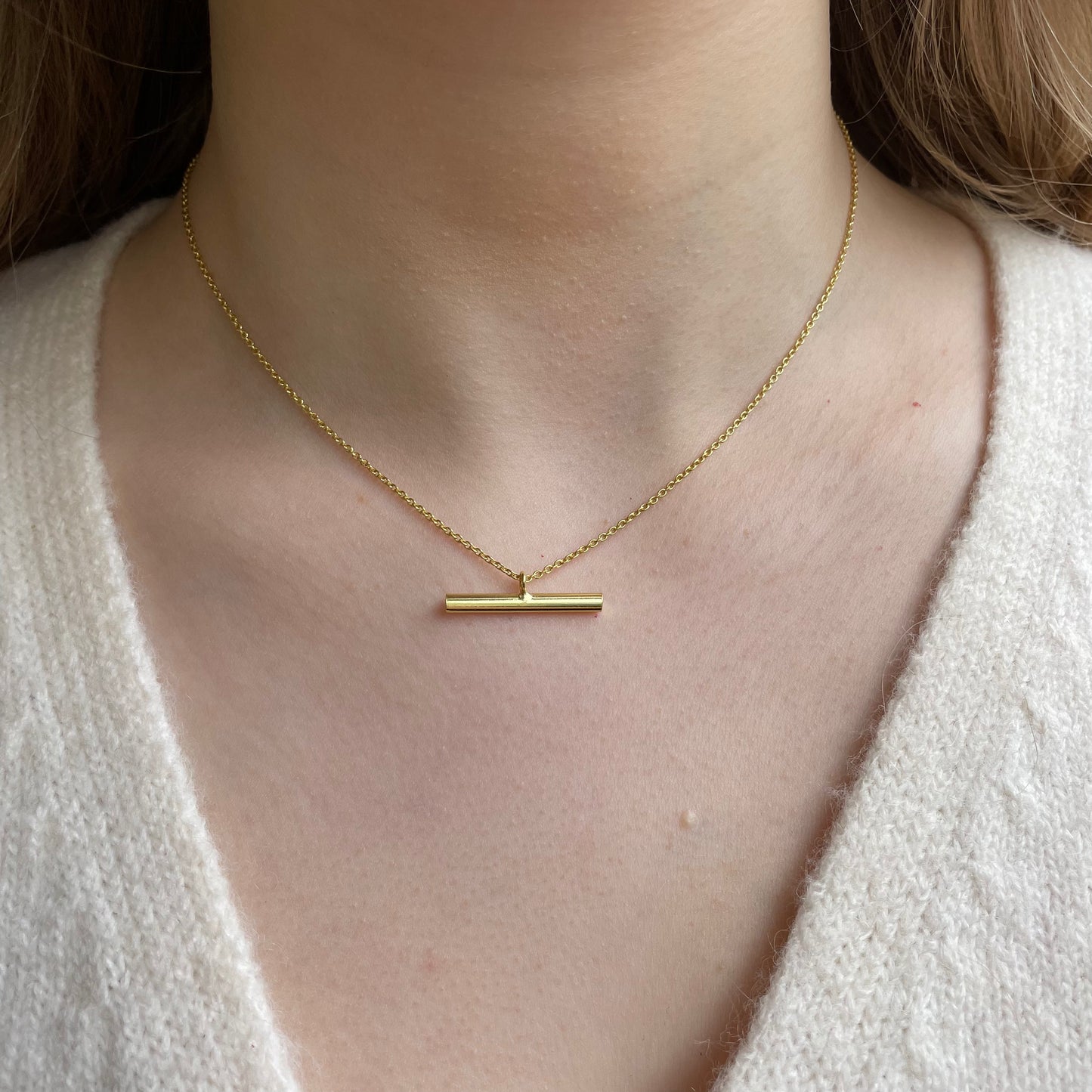 CME Sunshine T-Bar Necklace featuring a gold-tone chain with a sun-shaped pendant, stylish jewelry for everyday wear
