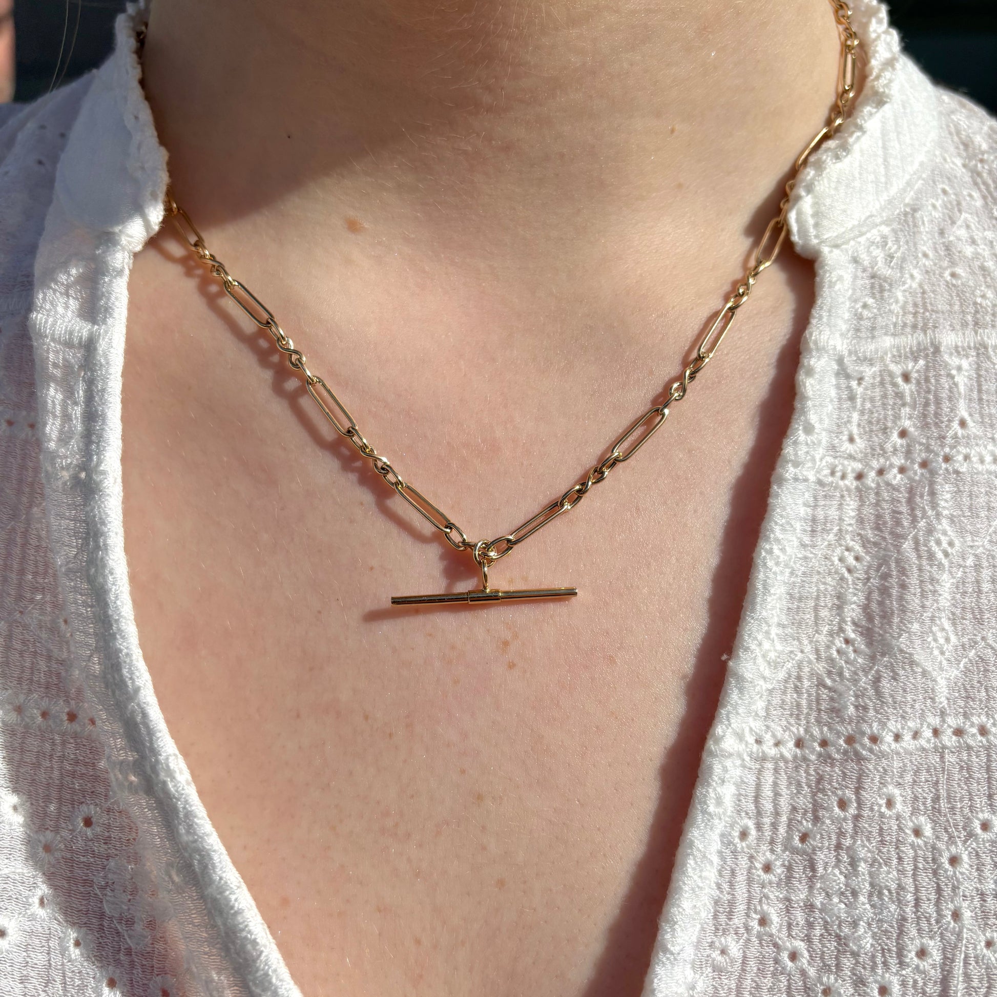 9ct gold T-bar necklace from PJD, 45cm chain with sleek T-bar pendant, displayed against a neutral background.