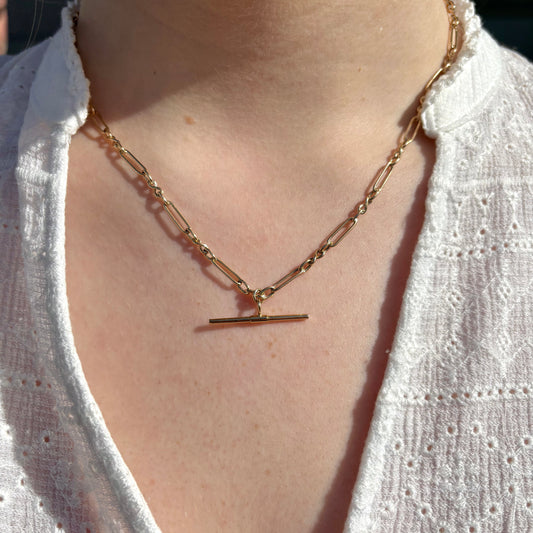 9ct gold T-bar necklace from PJD, 45cm chain with sleek T-bar pendant, displayed against a neutral background.