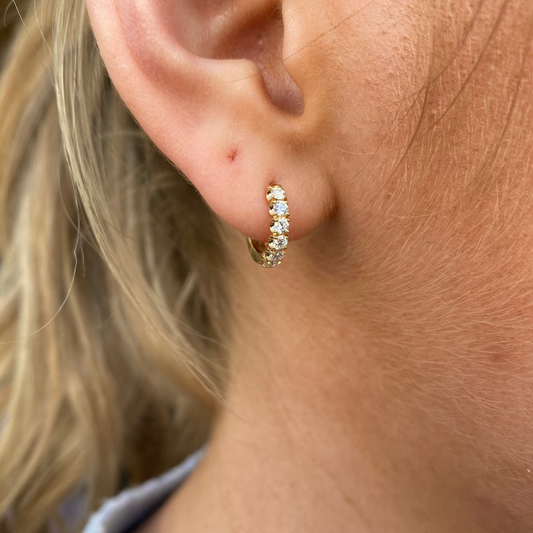 Lanza 18ct gold diamond hoop earrings with 0.42ct sparkling diamonds, showcasing elegant jewelry design.