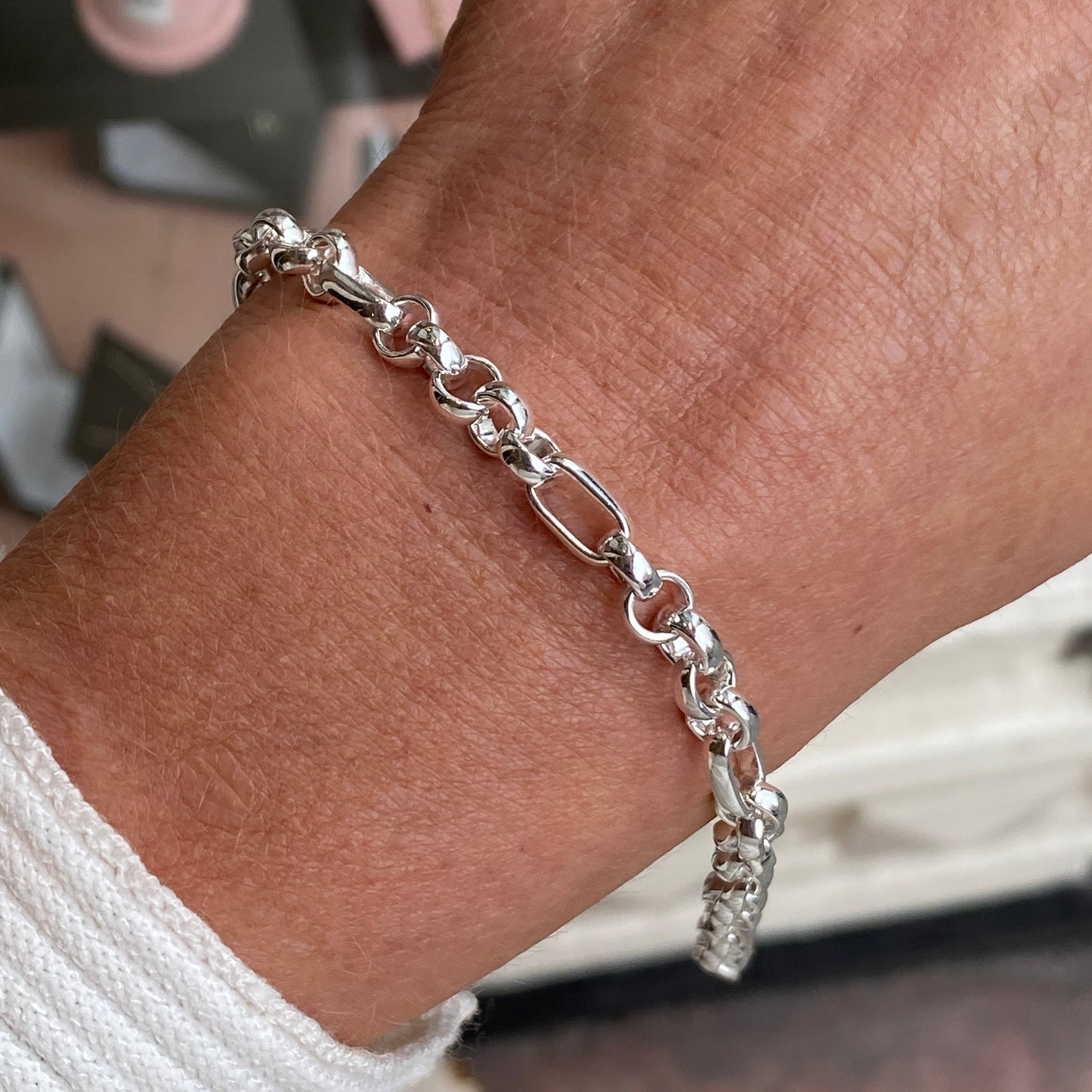 Herbert silver belcher and long link bracelet, 7.5 inch size, showcasing shiny interconnected links on a neutral background.